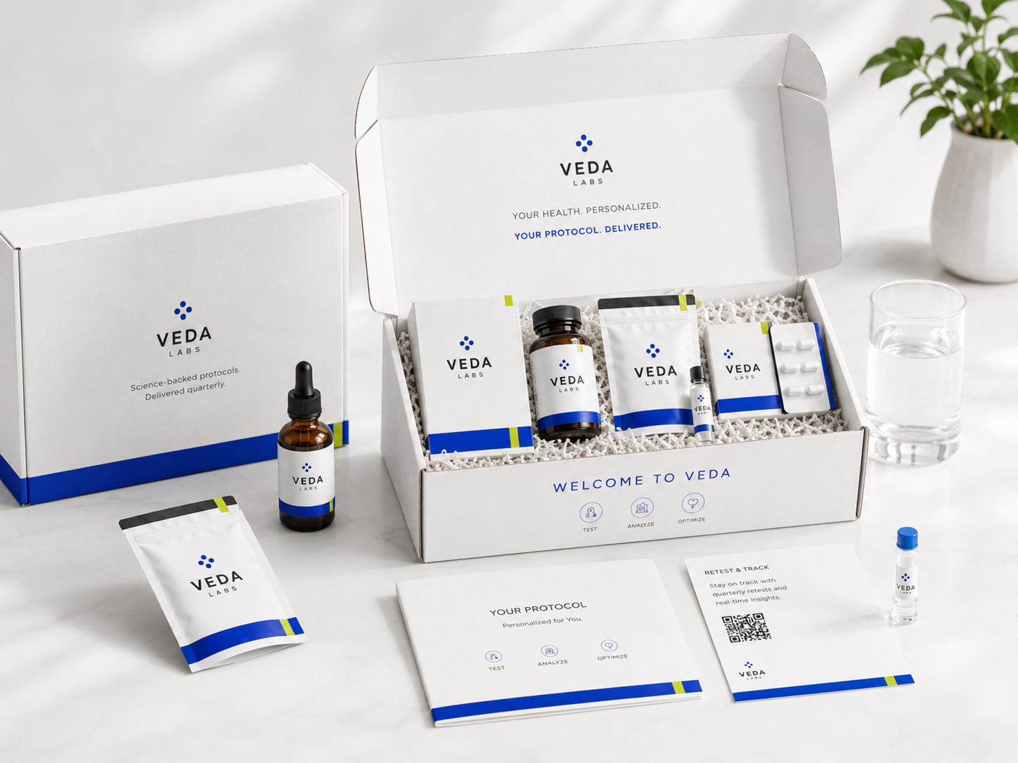 Veda Labs welcome kit unboxed: branded box with vials, supplements, sachet, protocol card, and welcome booklet